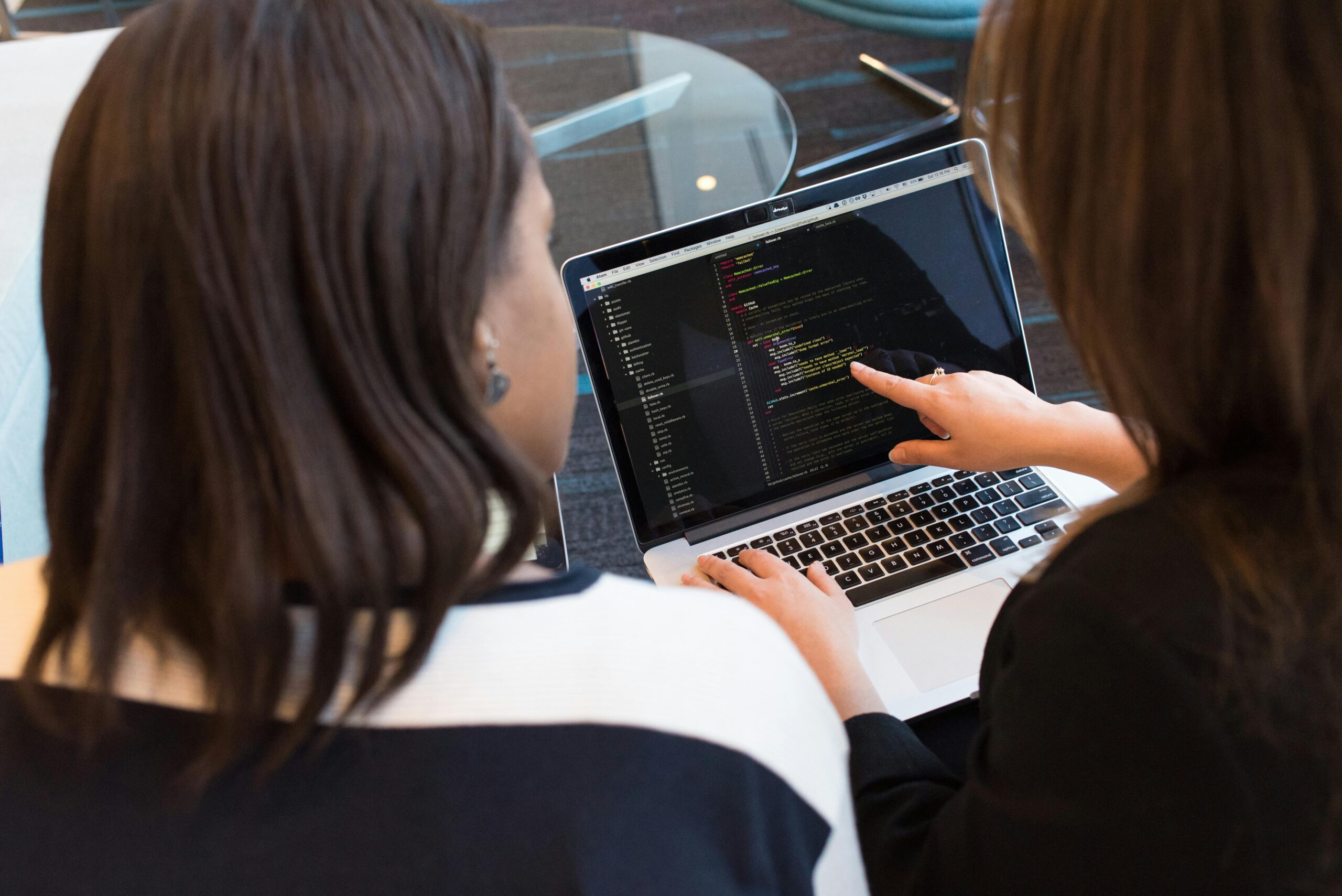 Hacked By Opening An Email - 2 Girls Looking at Laptop of Code